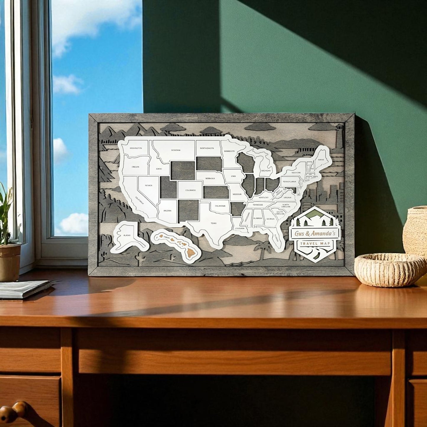 Wooden travel map of the United States on a wall above a wooden desk.