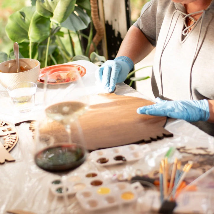 Friends enjoying a creative DIY sign-making workshop at Foxwood Engraving