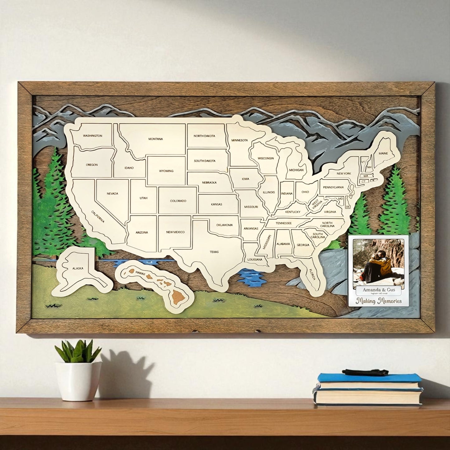 Wooden map of the United States with a wooden frame on a wall above a shelf.