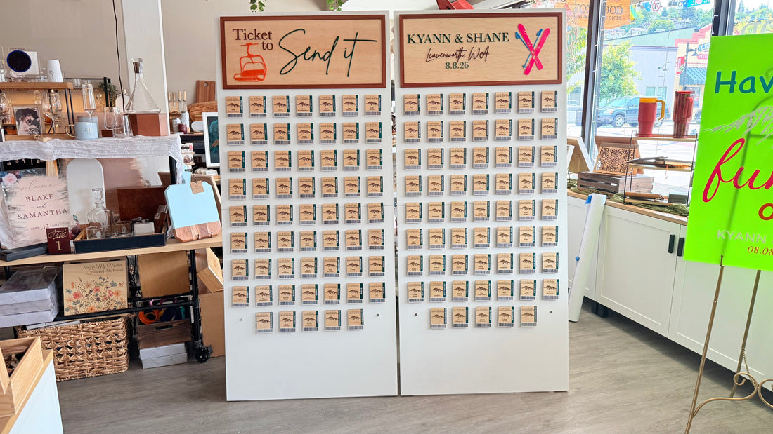 Two six-foot custom wedding seating panels featuring removable ski-pass magnets for a Leavenworth celebration.