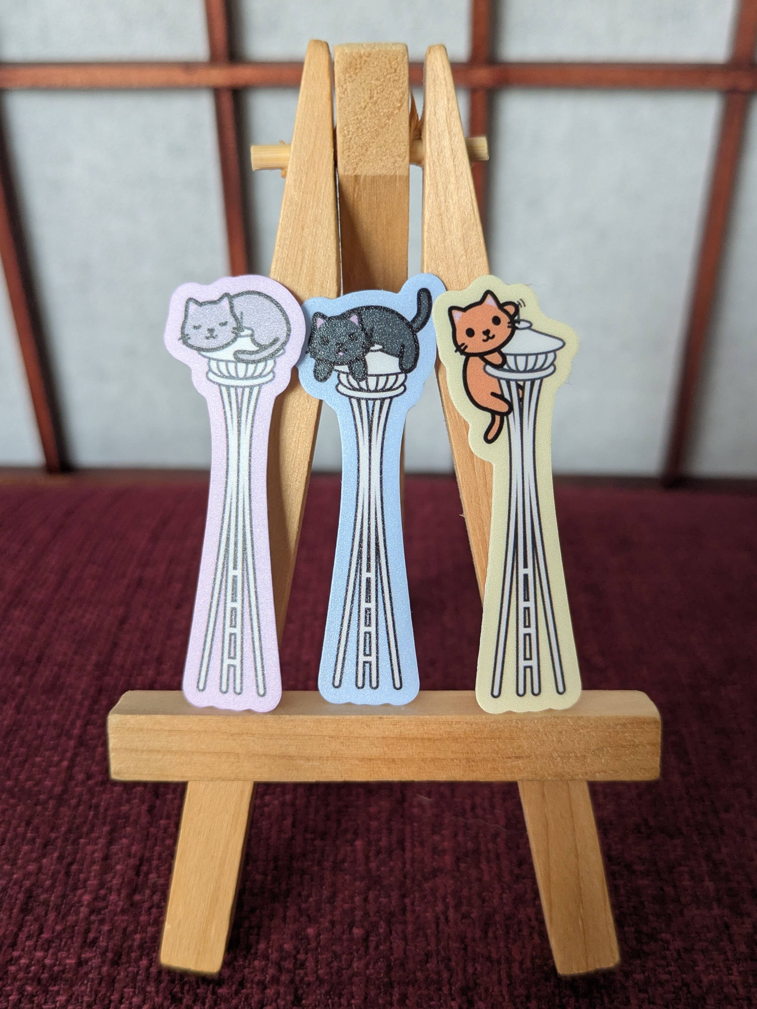 Cats on the Space Needle Seattle vinyl waterproof sticker: Orange cat with yellow background