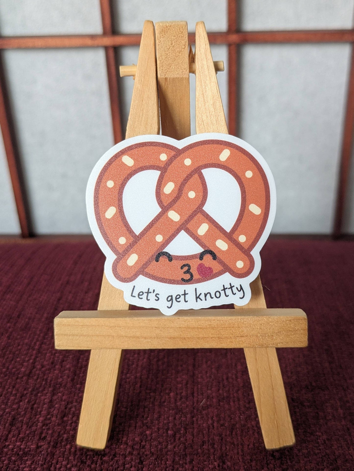 Let's get knotty naughty pretzel pun waterproof sticker