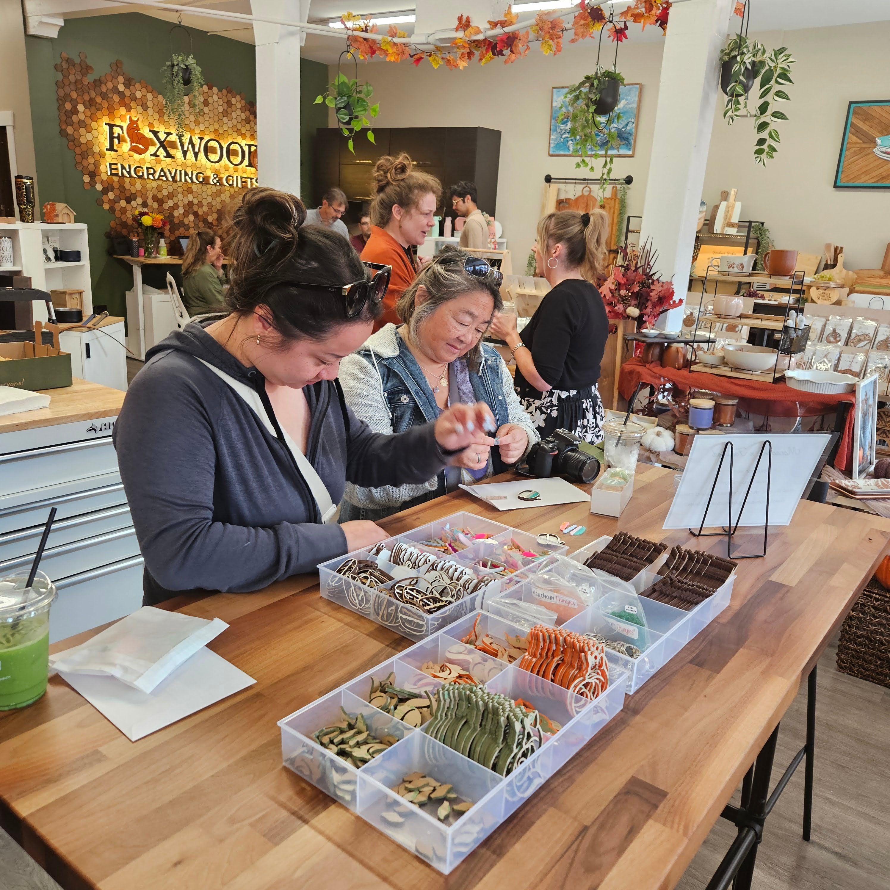 Guests participating in a hands-on workshop at Foxwood Engraving in downtown Renton, highlighting community events and creative experiences