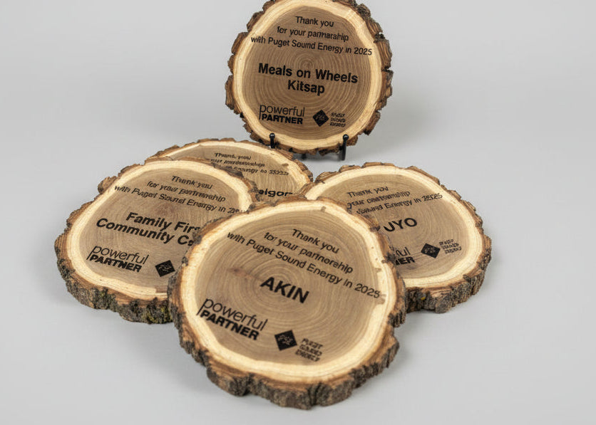 Wooden cutouts with engraved text on a table