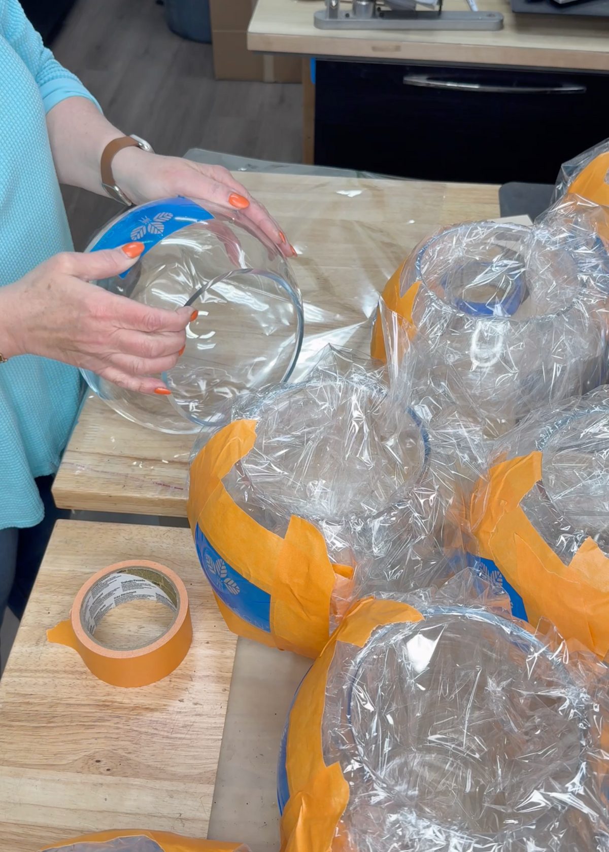 Preparing glass for custom engraving at Foxwood Engraving, showing in-house process, precision masking, and professional craftsmanship