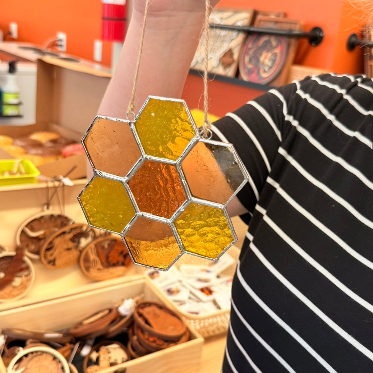 Finished handmade stained-glass suncatchers created during a Salty Bird Glass workshop at Foxwood Engraving.