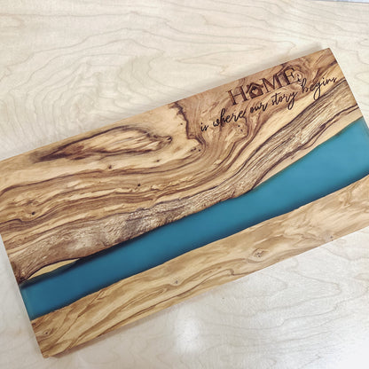 OLIVE WOOD CUTTING BOARD WITH RIVER OF BLUE RESIN