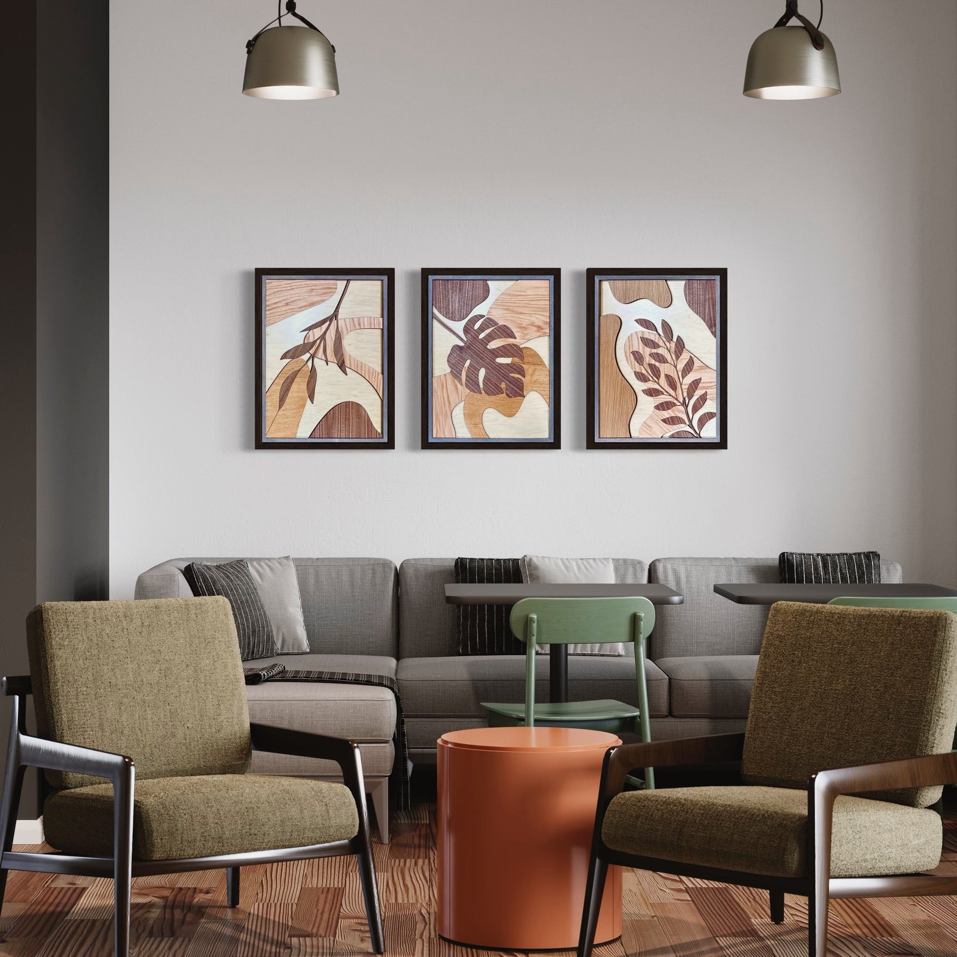 Modern living room with gray sofa, green chairs, and a plant.