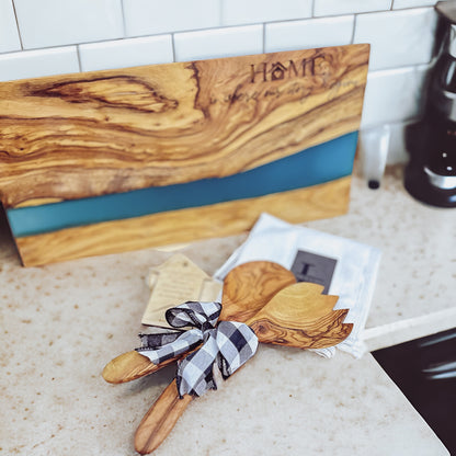 OLIVE WOOD CUTTING BOARD WITH RIVER OF BLUE RESIN