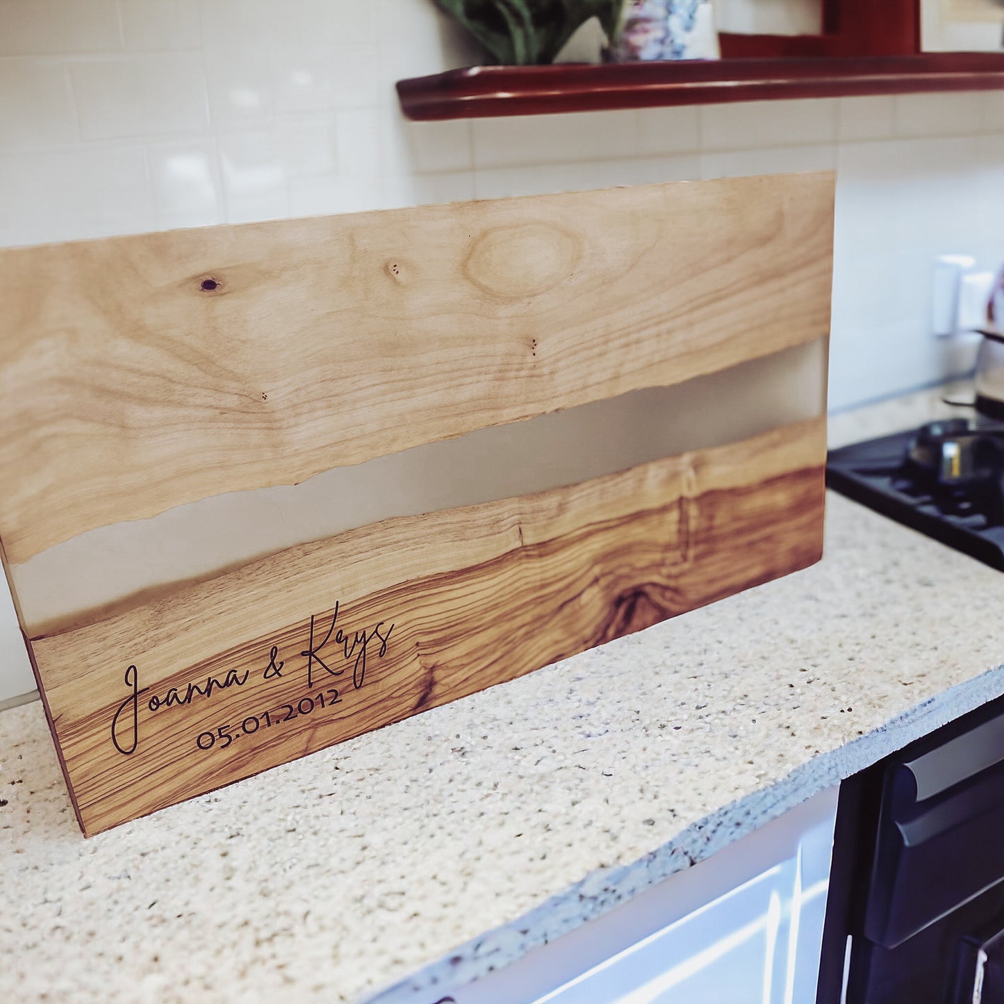 OLIVE WOOD CUTTING BOARD WITH RIVER OF CLEAR RESIN