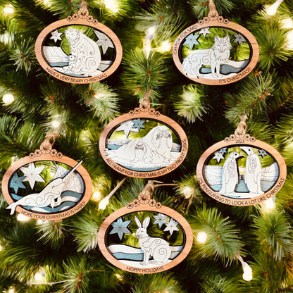 Foxwood Engraving Arctic Animals ornament collection featuring hand-painted wood designs.