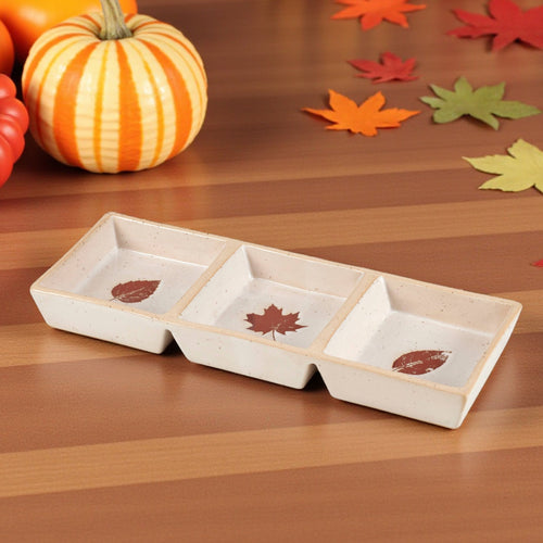 Fall-themed ceramic serving dish with three sections and leaf designs