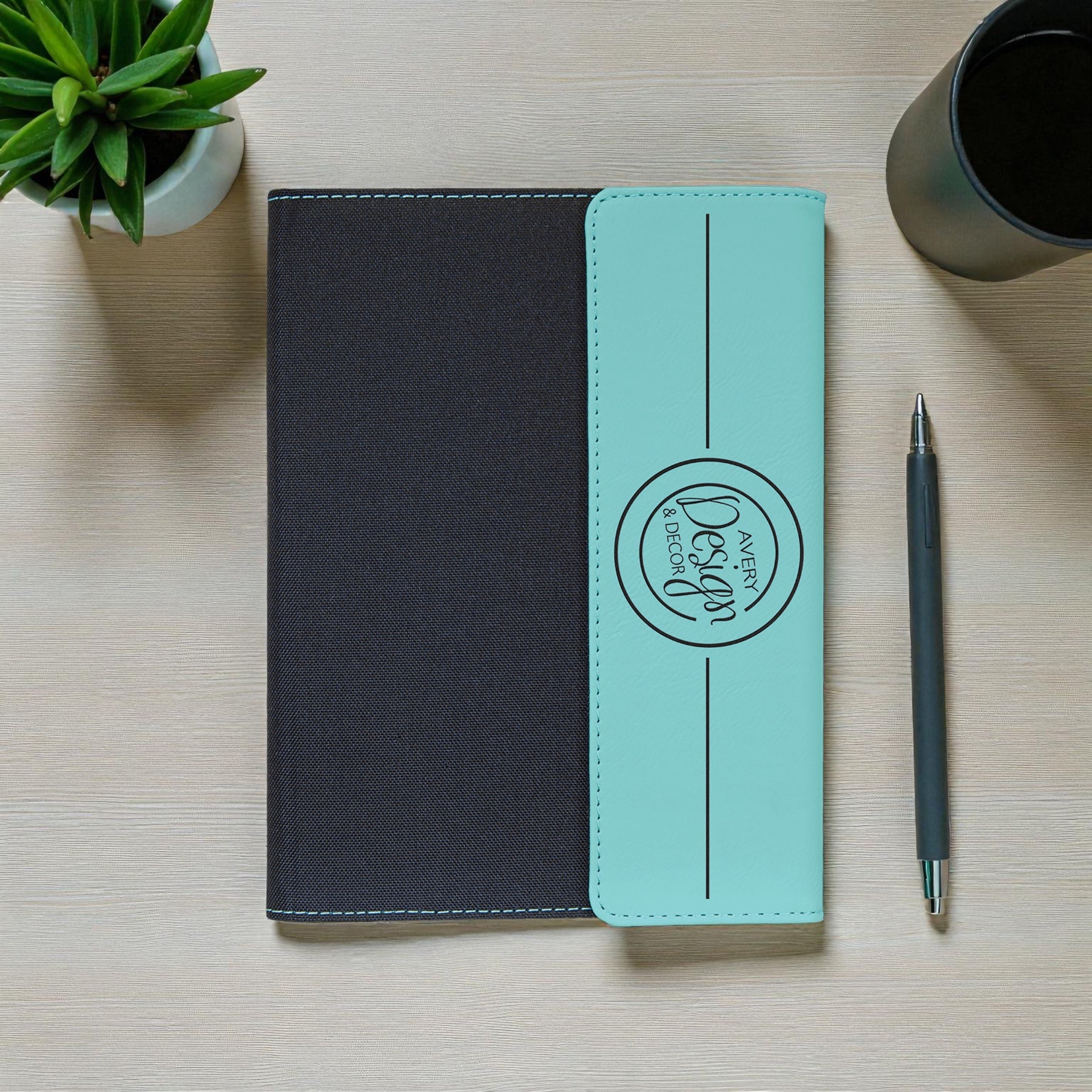 Corporate logo notebook in brown leather and grey fabric with professional design.