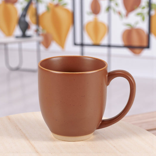 Red stoneware mug with rustic bare ceramic accents.