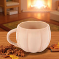 Cream pumpkin-shaped stoneware mug from Foxwood Engraving Fall Collection.