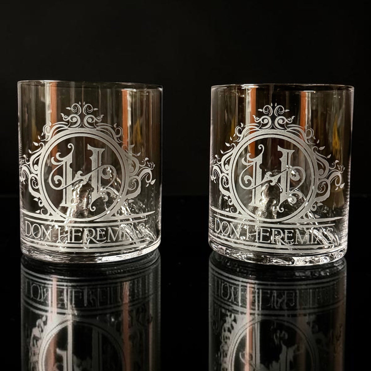 Personalized engraved whiskey glasses, wine glasses, and barware customized with monograms, logos, and special occasions.