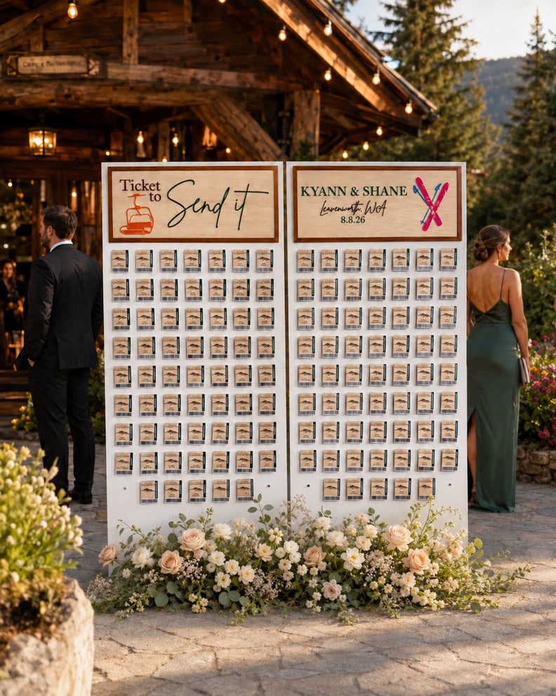 Large custom ski-themed wedding seating chart with individual ticket-style escort cards and floral decoration.