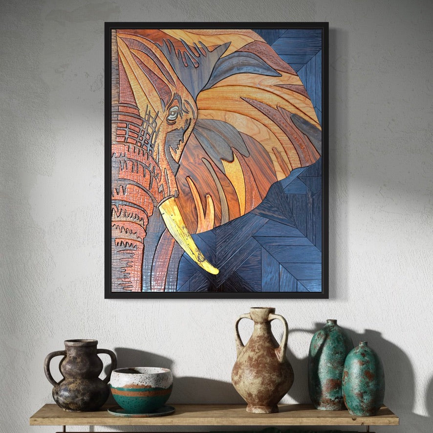 Framed dimensional elephant intarsia artwork made from layered contrasting hardwoods.