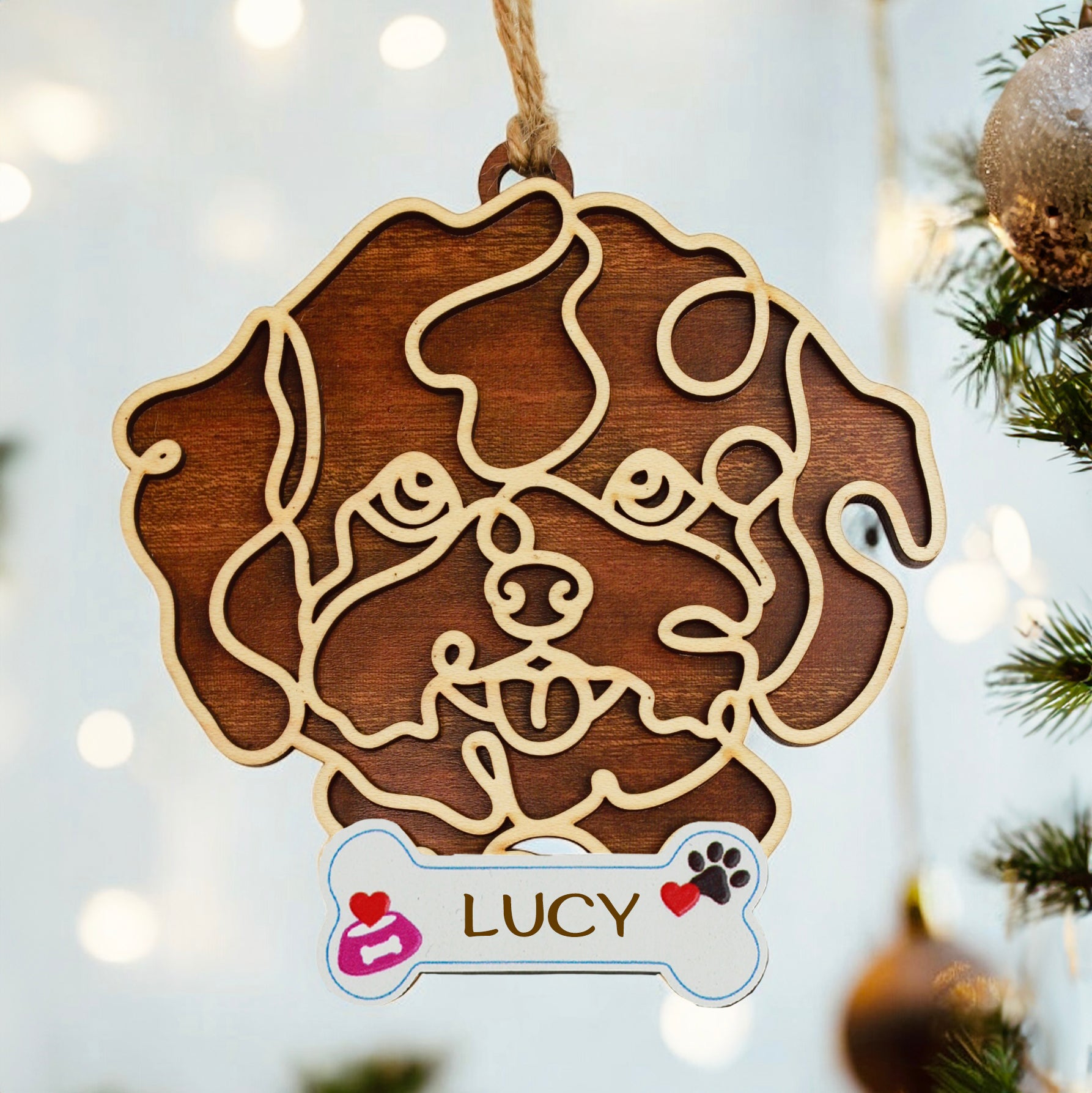 Personalized dog ornament with engraved bone tag name.