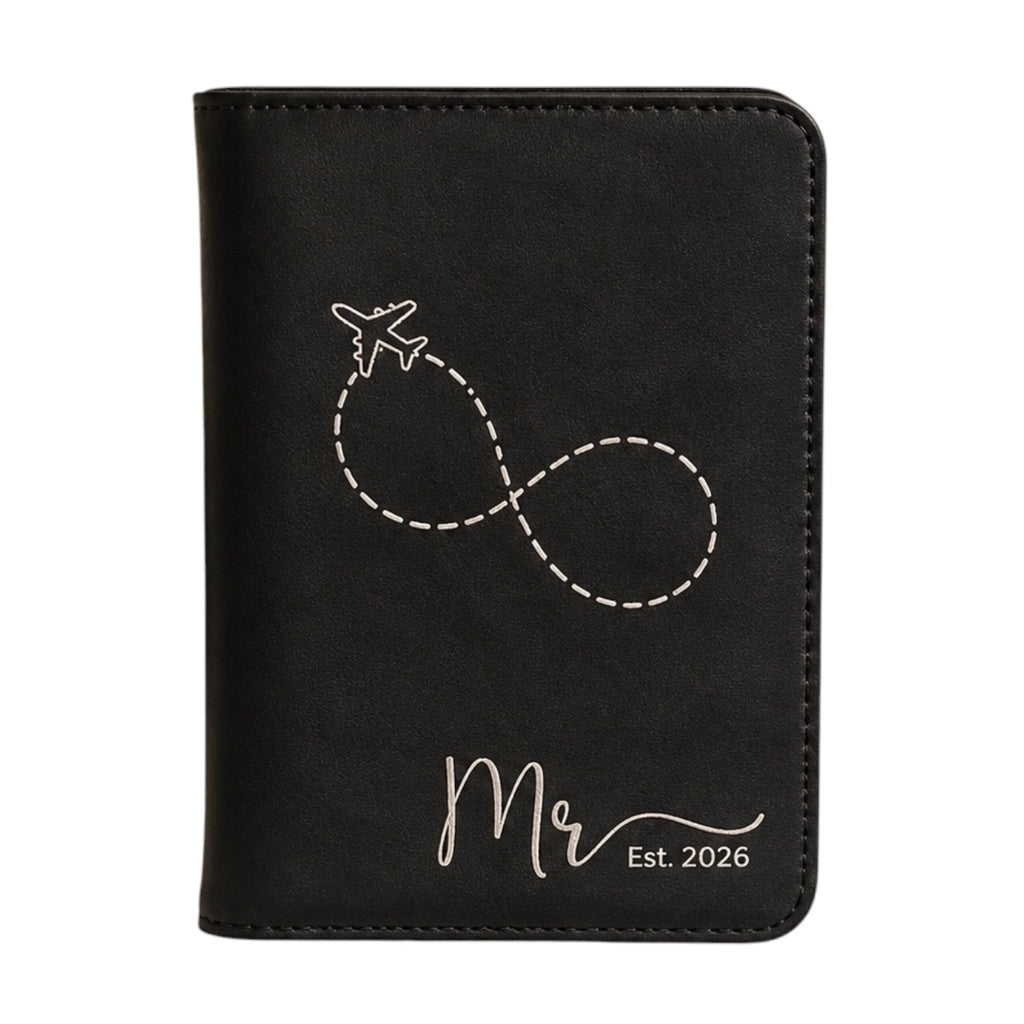 Close-up of engraved leatherette passport holder for men.