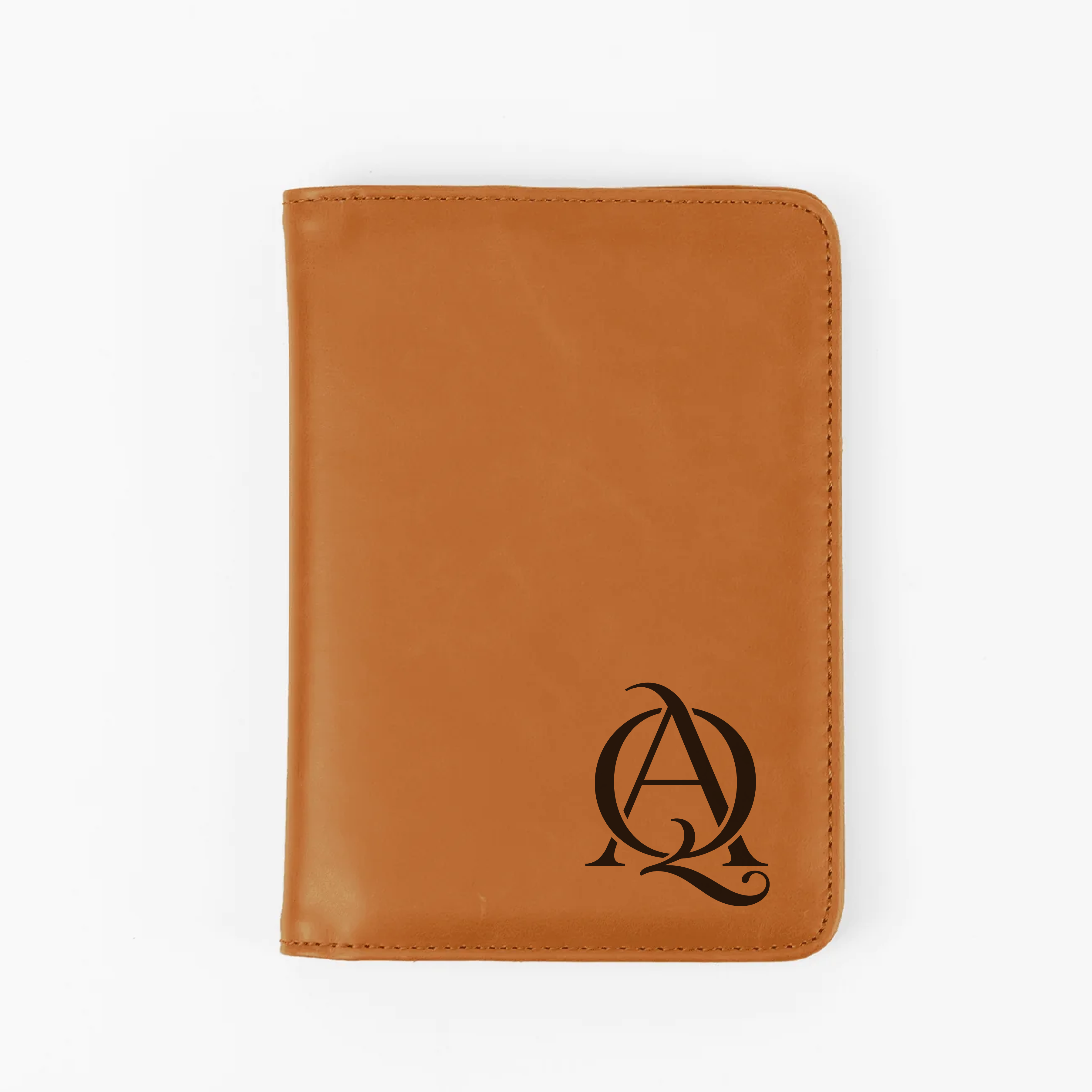 Close-up of laser engraved logo on leatherette passport wallet.