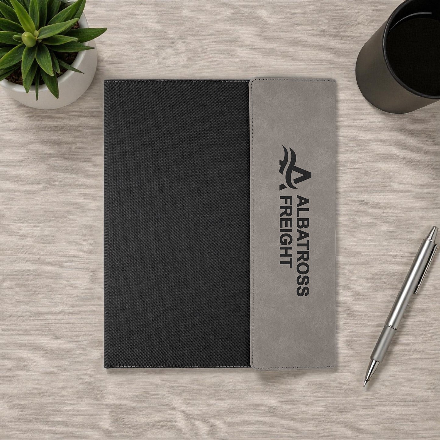 Executive notebook with engraved or UV printed company logo on vegan leather cover.