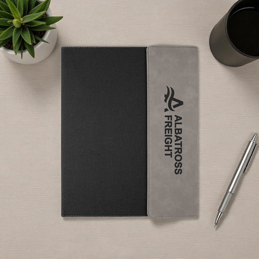 Executive notebook with engraved or UV printed company logo on vegan leather cover.