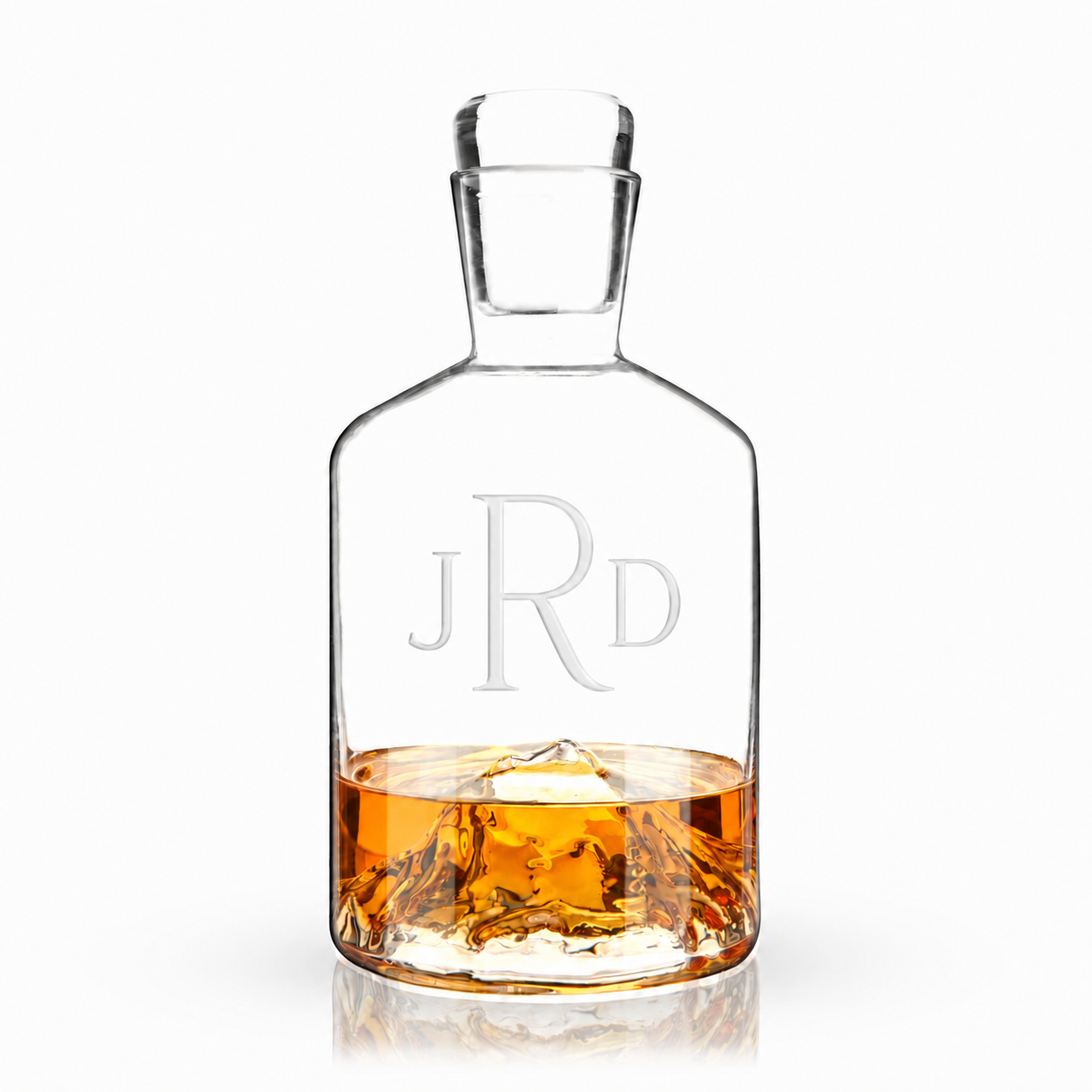 engraved mountain crystal decanter with whiskey inside
