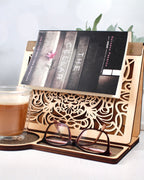 Laser engraved wooden book stand shown in birch wood with decorative reading design