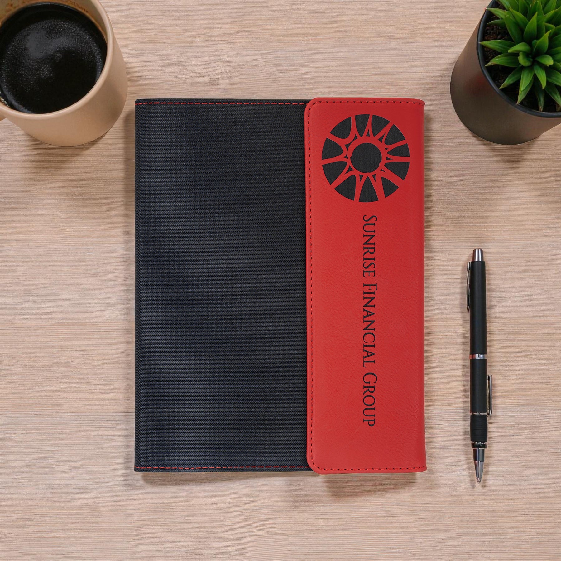Foxwood Engraving engraved portfolio notebook displayed on modern desk.