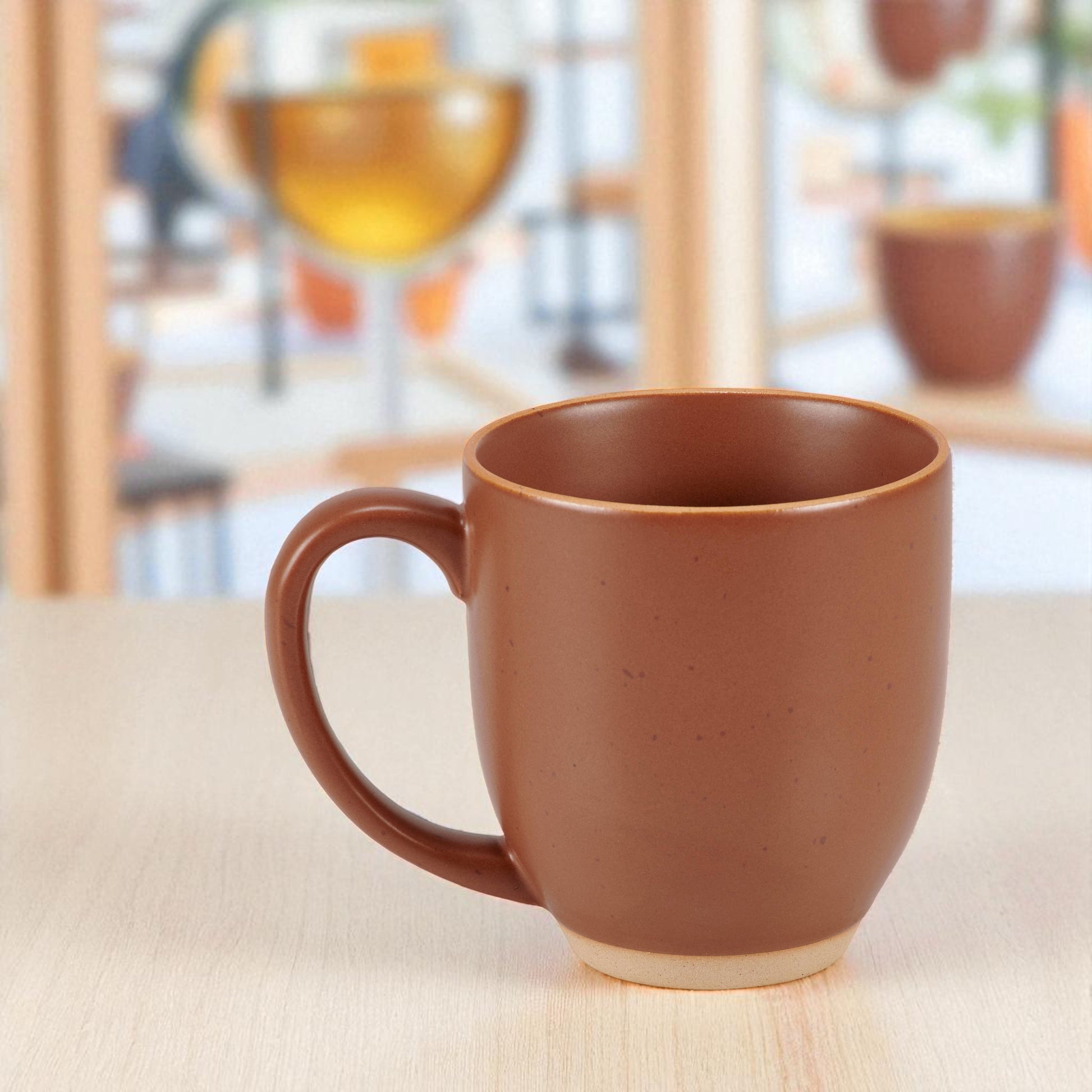 Farmhouse style stoneware mug in warm red tone.