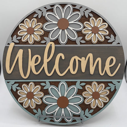 Layered floral wooden welcome sign created in DIY workshop.