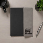 Foxwood Engraving engraved padfolio notebook displayed on modern desk.