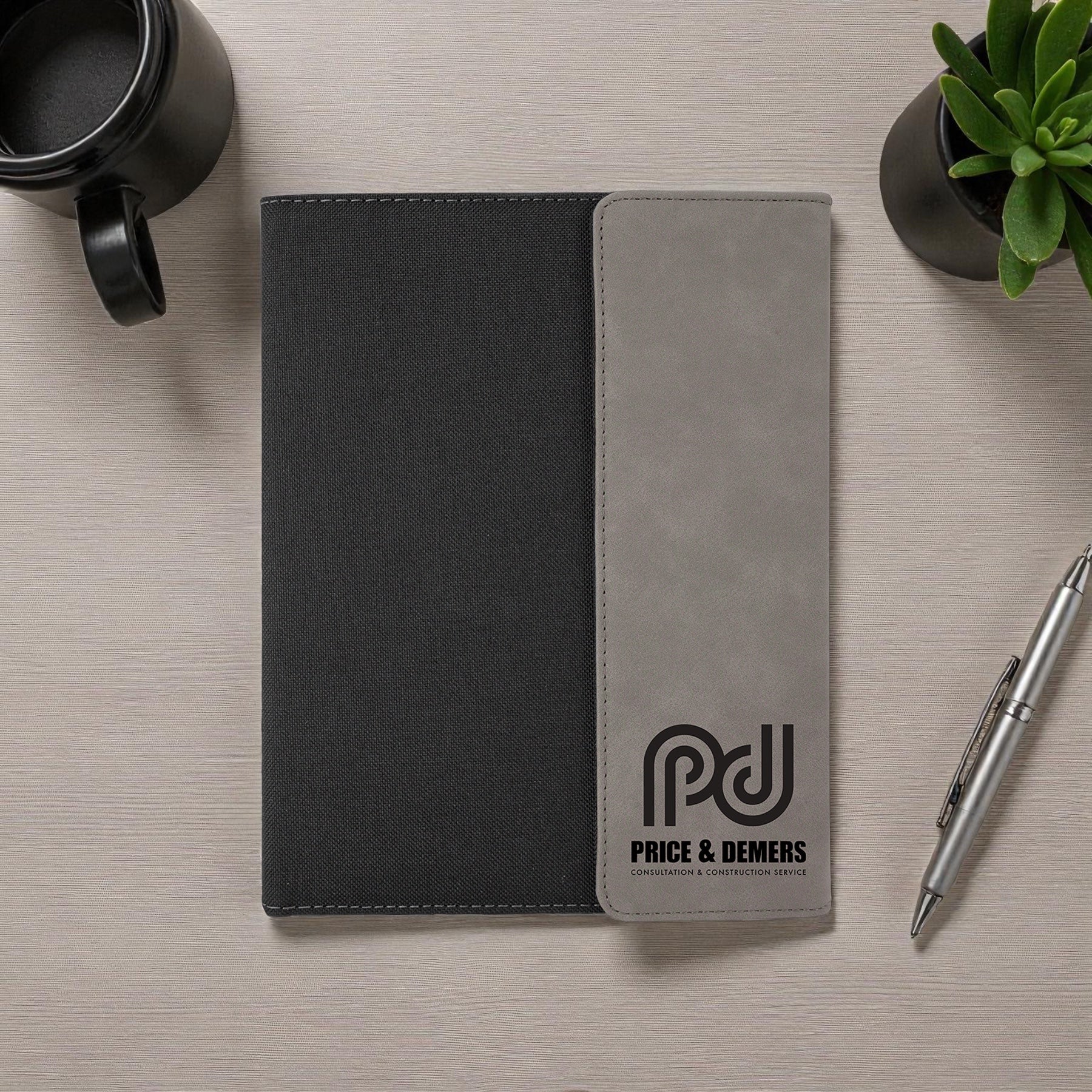 Foxwood Engraving engraved padfolio notebook displayed on modern desk.