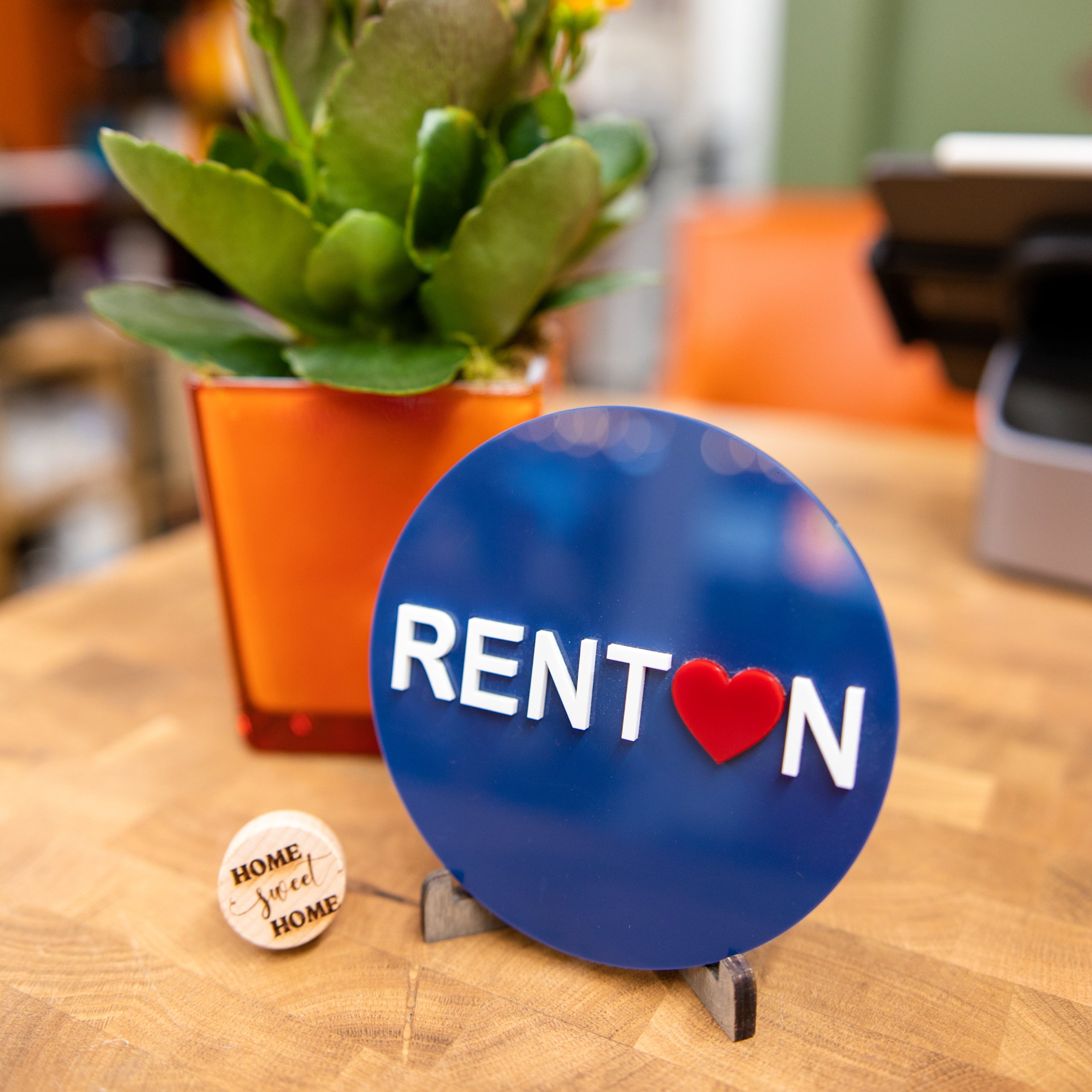 Renton sign displayed inside Foxwood Engraving, representing the company's commitment to supporting the downtown Renton community and local businesses.