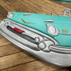 Close-up of 1957 Chevy Bel Air wooden wall art with metallic silver details.