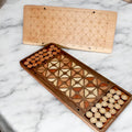 Handcrafted wooden Fanorona strategy board made from walnut and maple.