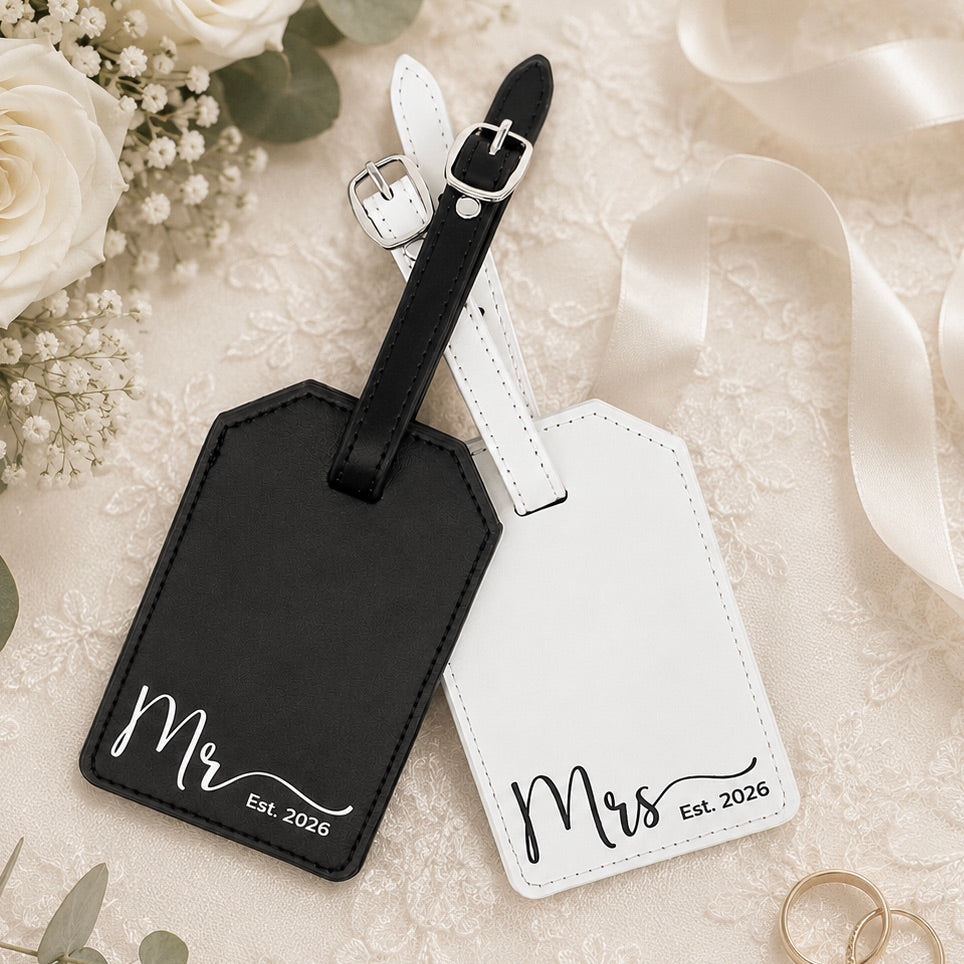 Matching luggage tags for honeymoon travel personalized with names.