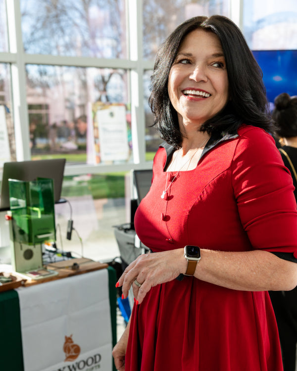Joanna Lis, founder and creative director of Foxwood Engraving, on-site engraving personalized gifts and custom engraved products at a gala