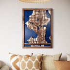 Wooden map of Seattle, WA in a frame on a wall with decorative pillows below.