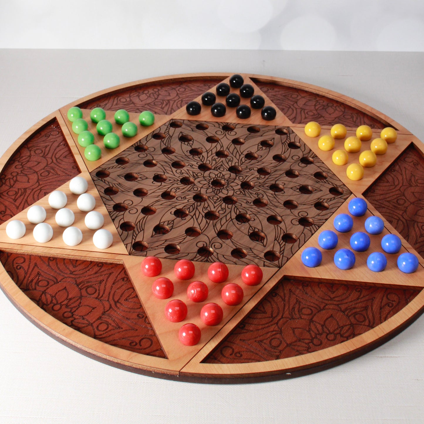 Foxwood Engraving handcrafted Chinese Checkers game board with natural wood finish.
