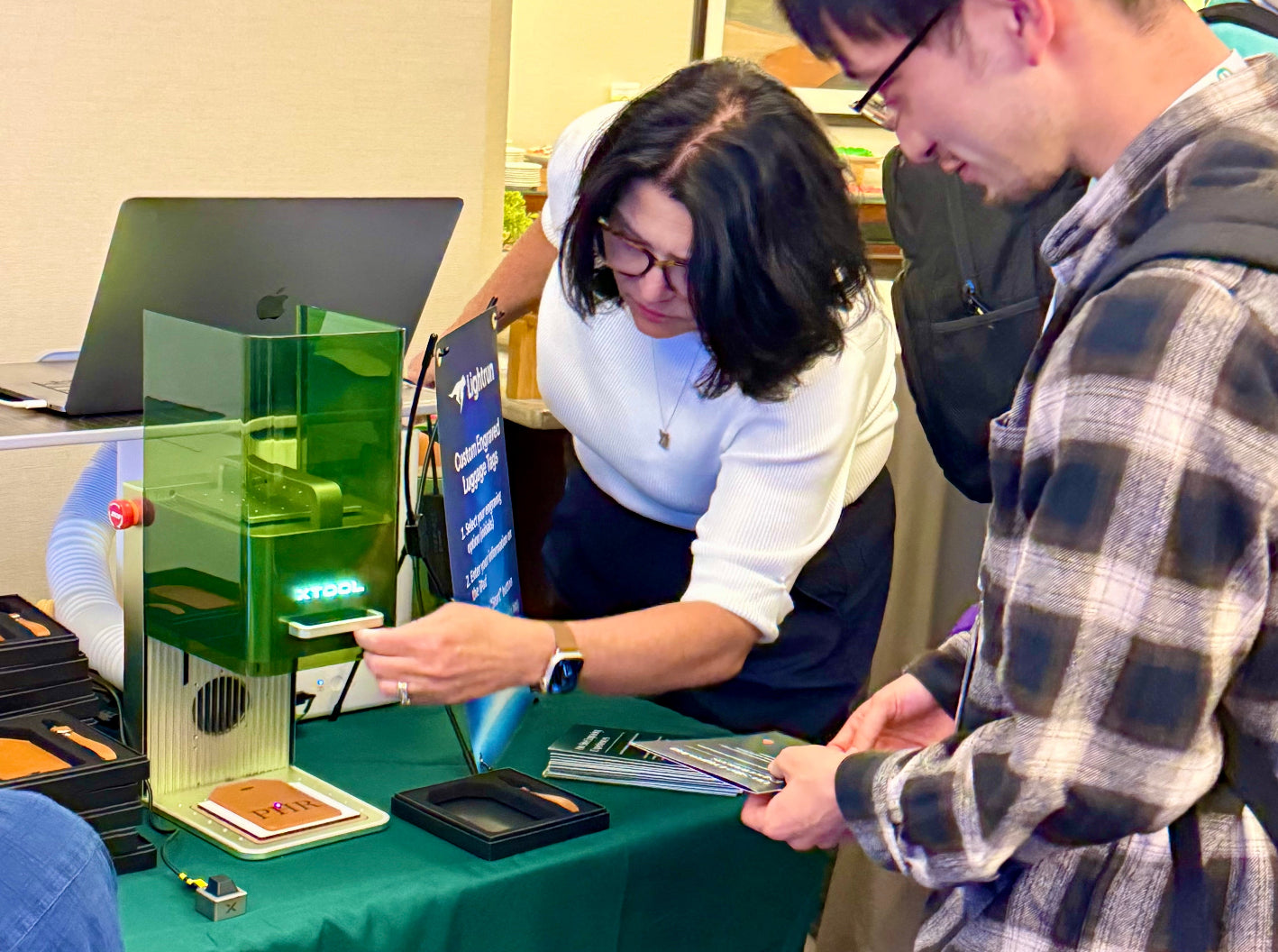 Foxwood providing live laser engraving for guests at the Lightrun booth during SRECon Seattle