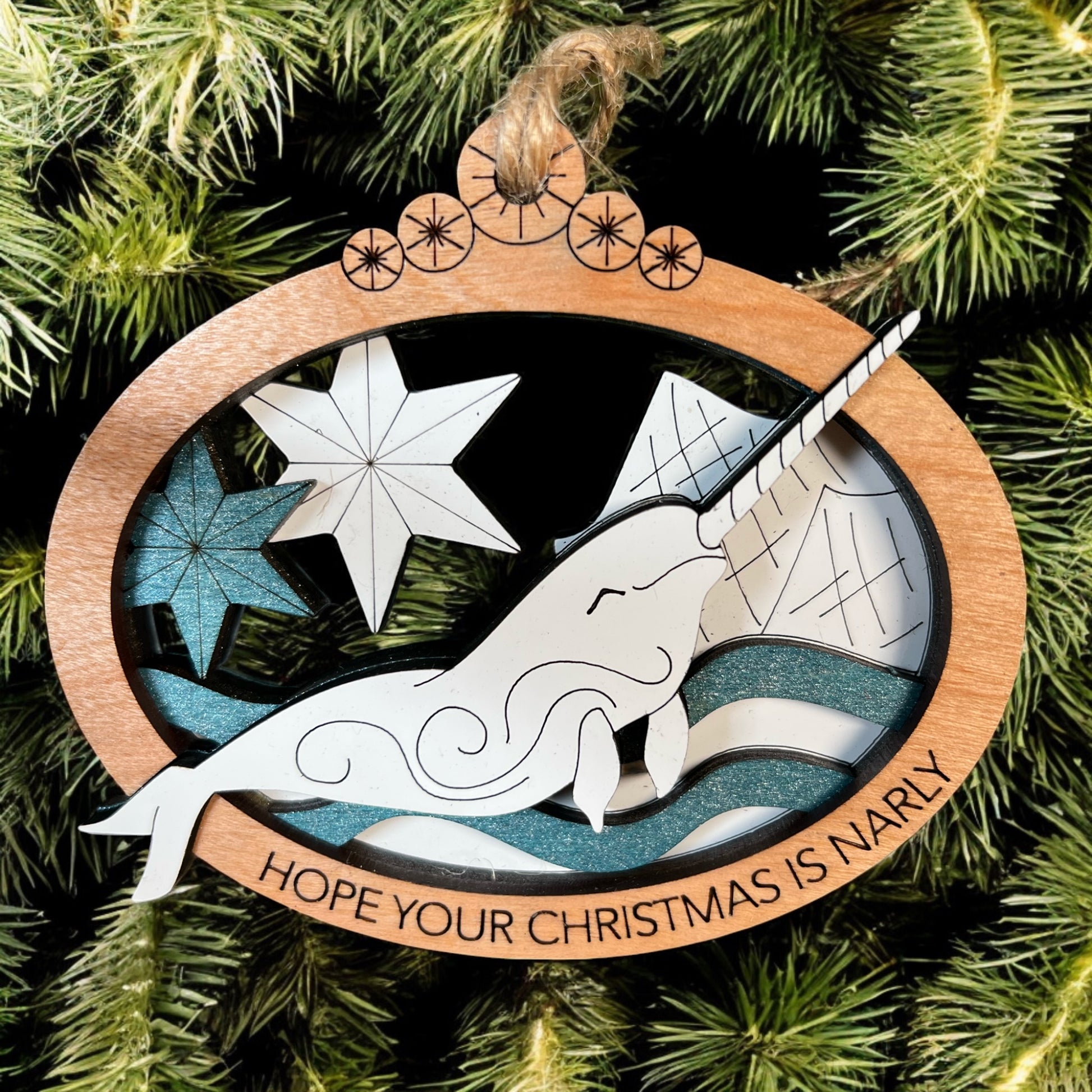Wooden narwhal Christmas ornament hand-painted with shimmering details.