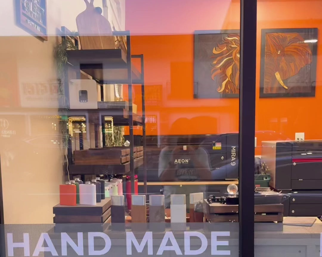 Interior view of Foxwood Engraving’s retail studio in downtown Renton, featuring engraving machines, custom gifts, and handmade art