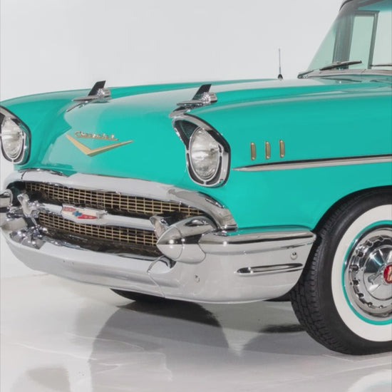 Video of Handcrafted layered wood wall art of a 1957 Chevy Bel Air in turquoise and chrome tones.