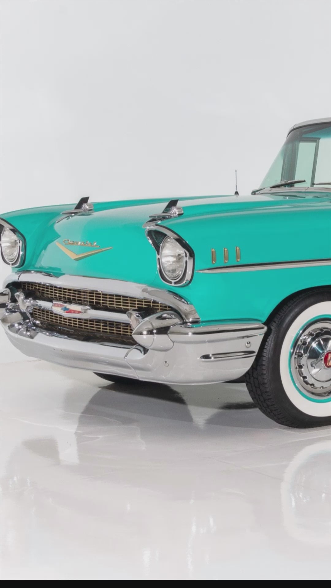 Video of Handcrafted layered wood wall art of a 1957 Chevy Bel Air in turquoise and chrome tones.