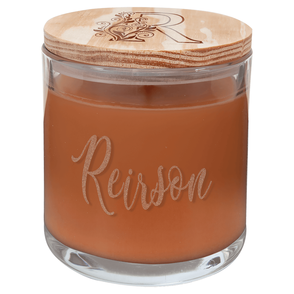 Pumpkin spice scented candle in clear glass jar