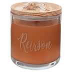 Pumpkin spice scented candle in clear glass jar
