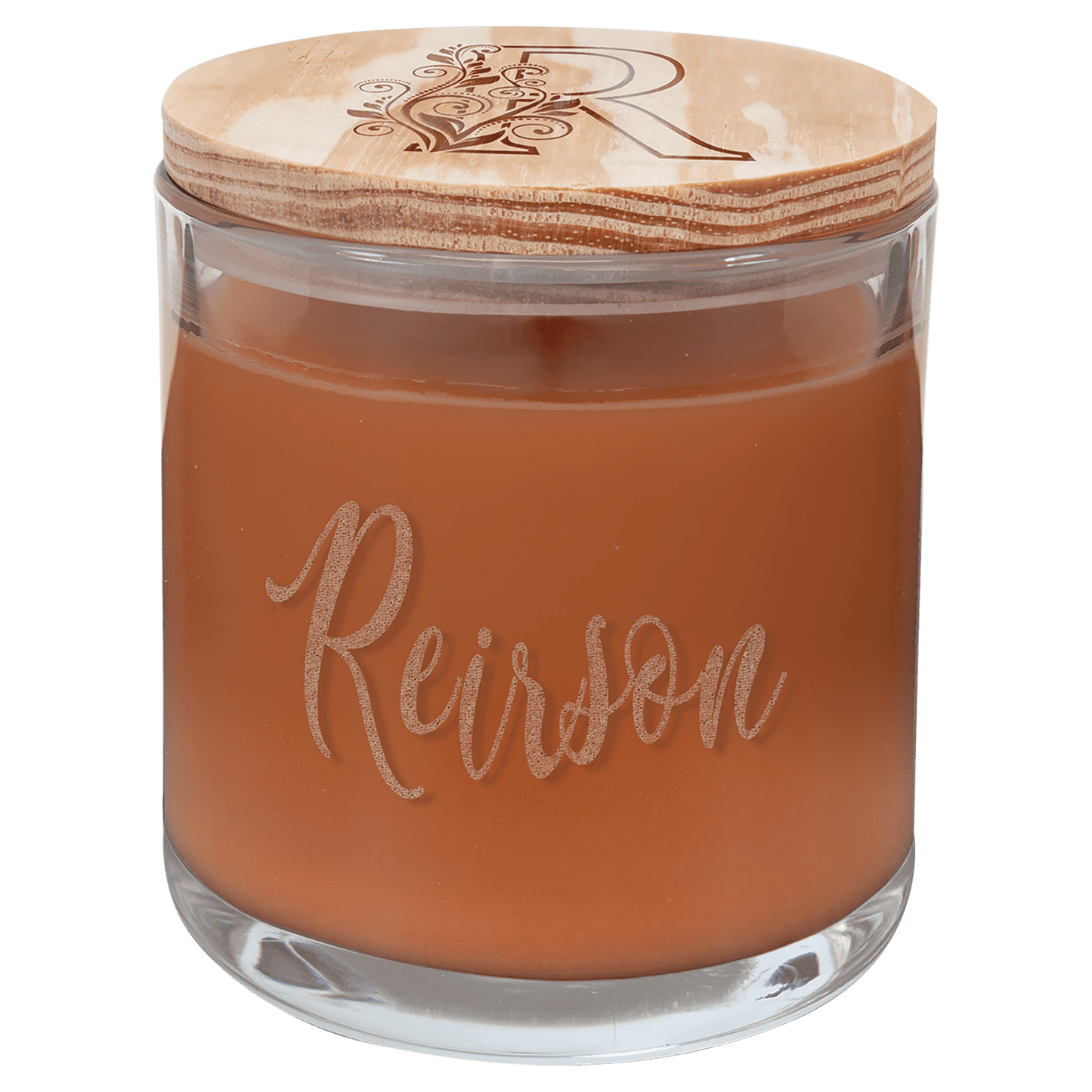 Pumpkin spice scented candle in clear glass jar