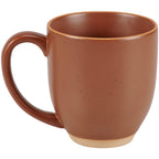 Red farmhouse coffee mug on rustic tabletop.